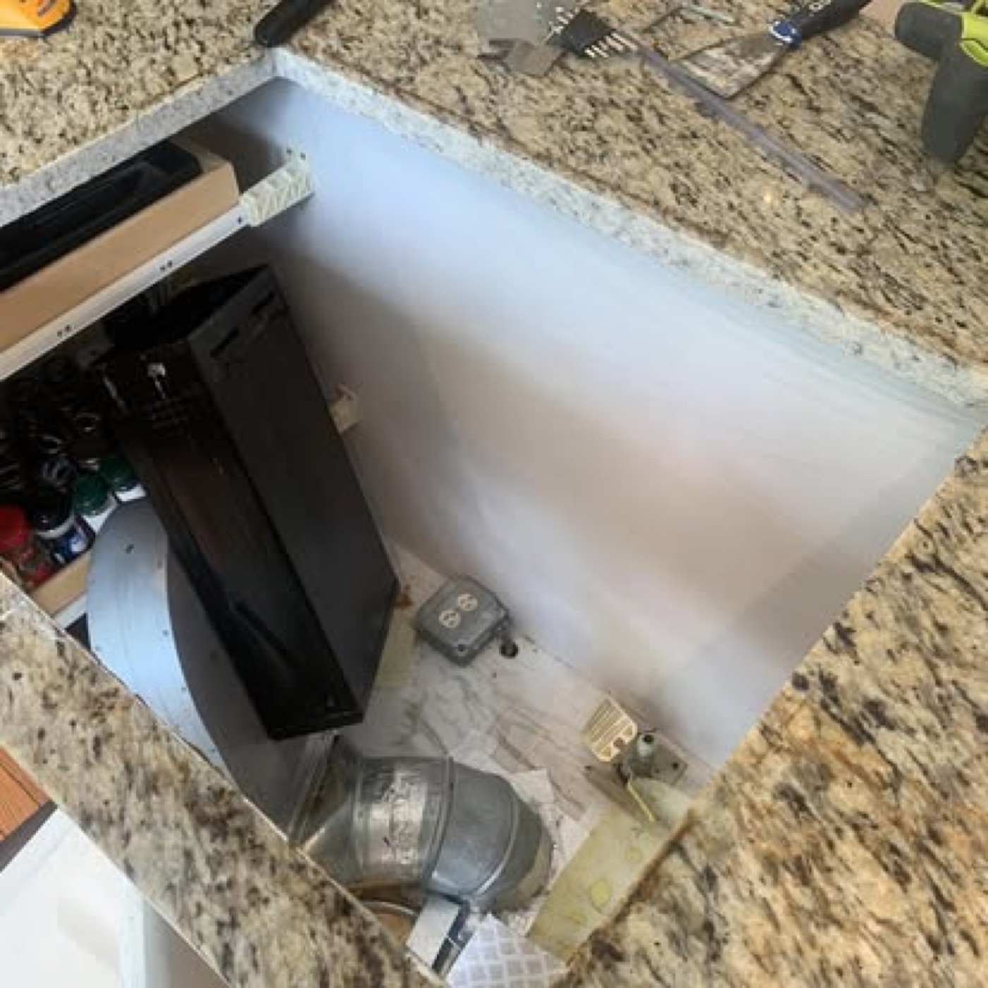 Countertop cutout with gas and electrical connections exposed