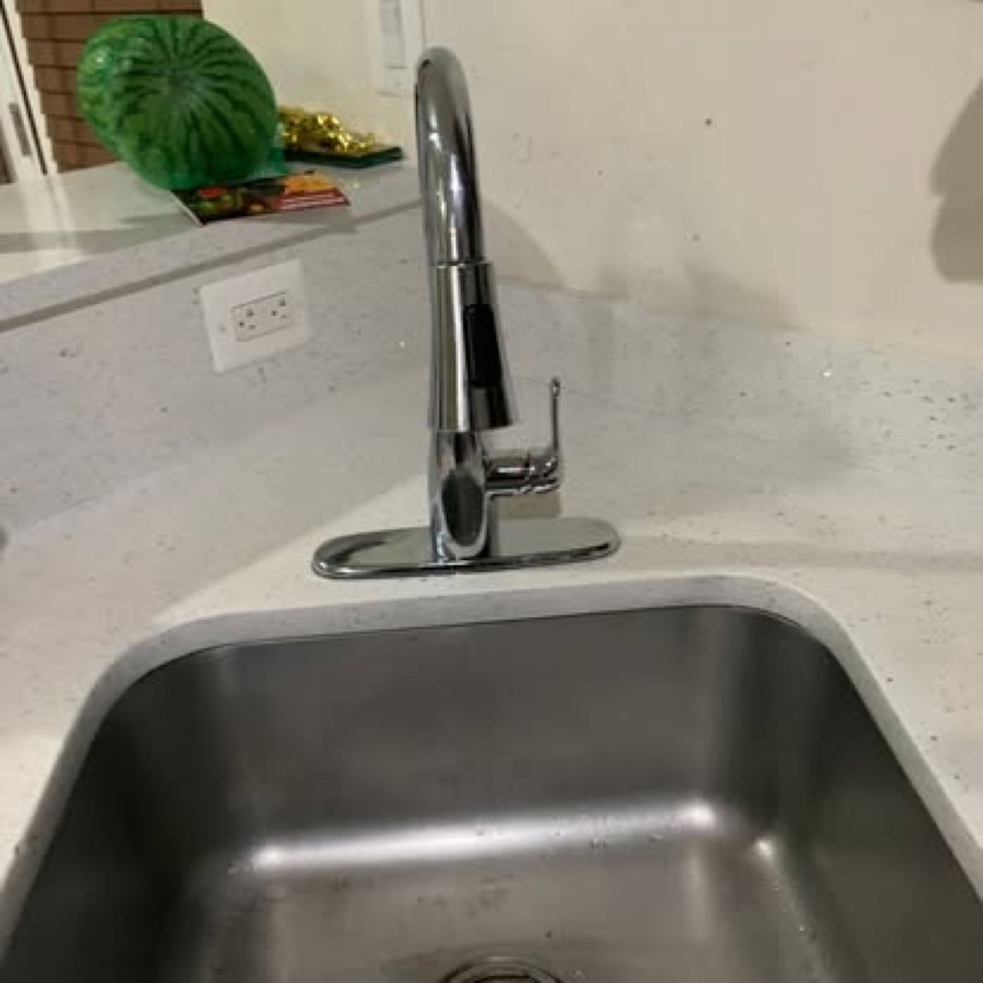 New chrome pull-down kitchen faucet installed