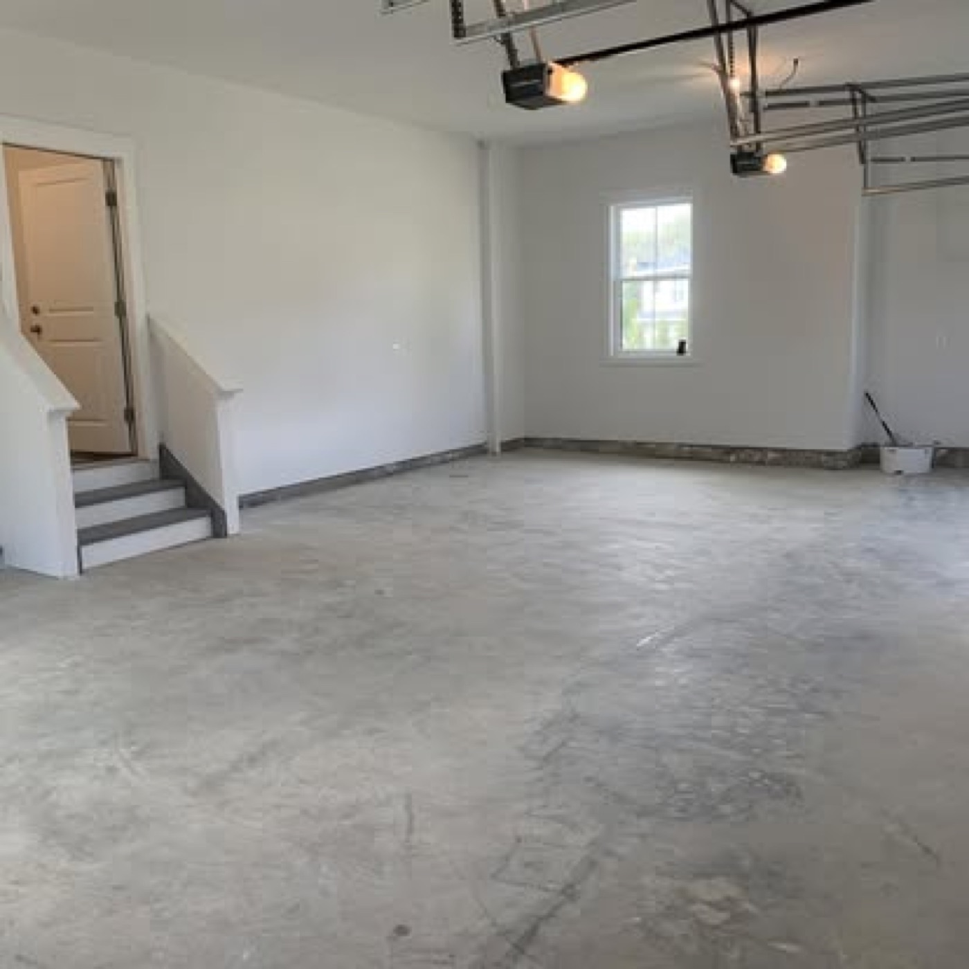 Bare concrete garage floor before epoxy