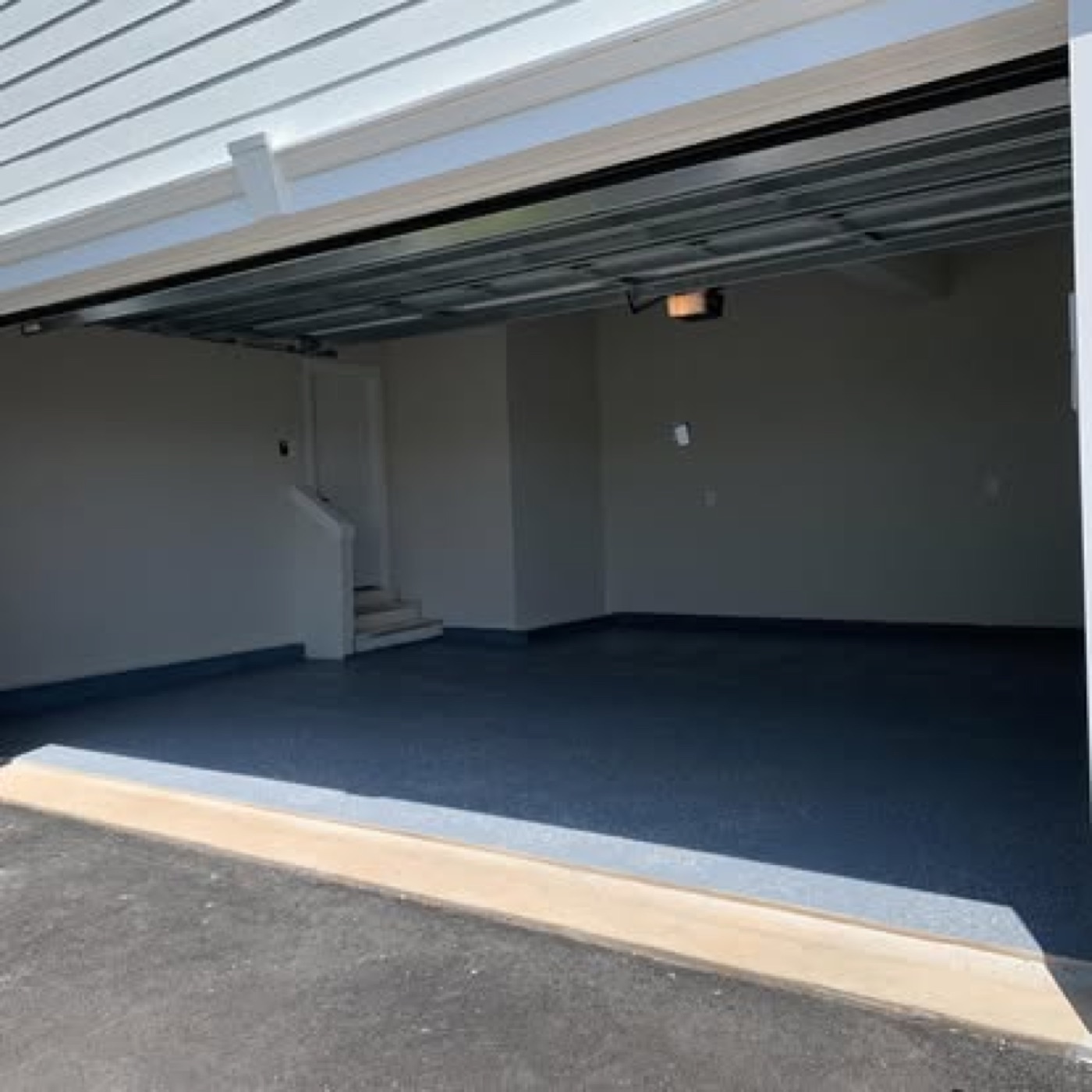 Blue flake epoxy garage floor with stairs