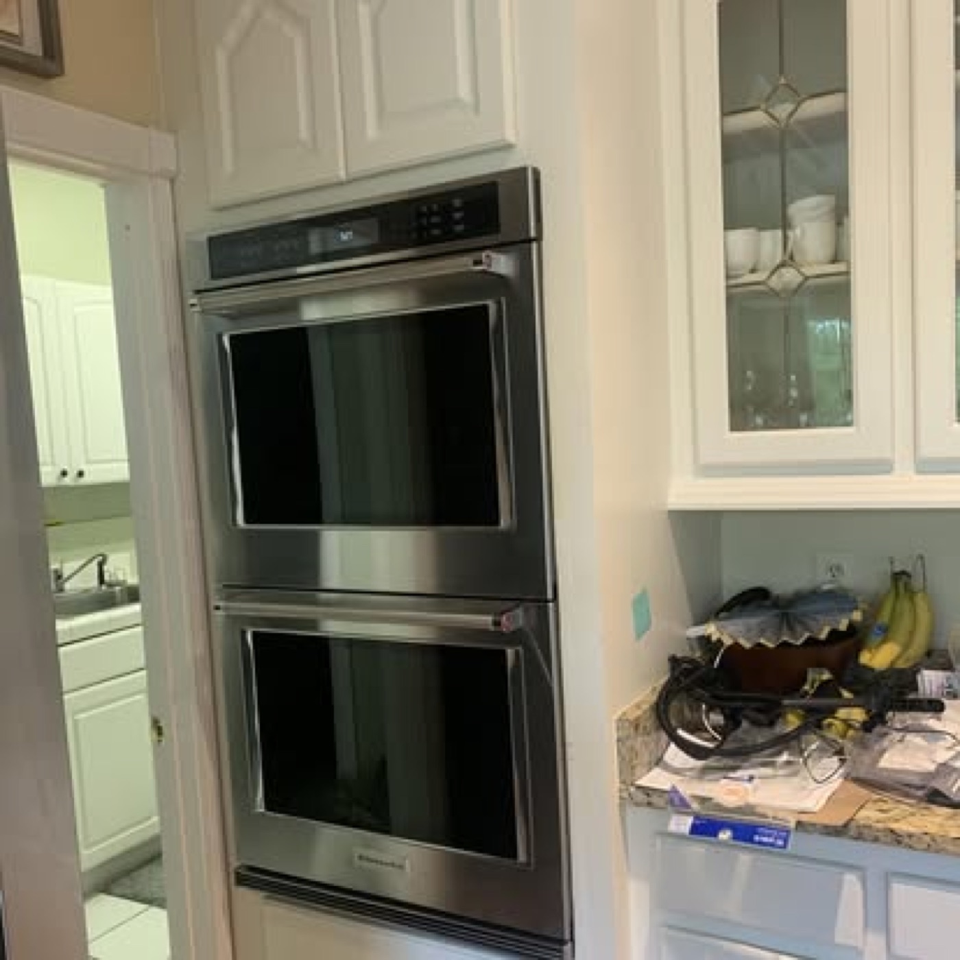New stainless steel double wall oven fitted into cabinetry